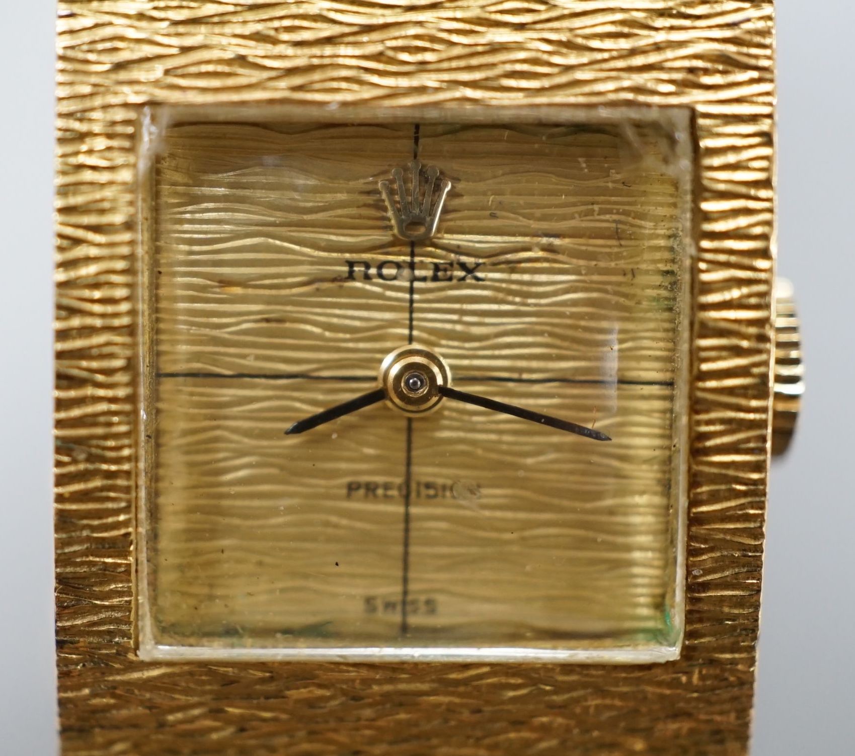 A lady's 1960's textured 18ct gold Rolex Precision manual wind bracelet watch, case diameter 17mm, gross weight 70.3 grams, with Rolex box, no papers.